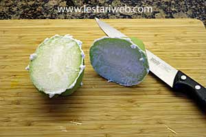 Cut the chayote in half